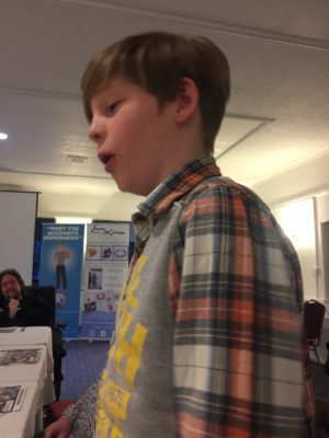 Boy speaking at a networking even