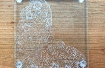 detail of glass butterfly engraved on glass