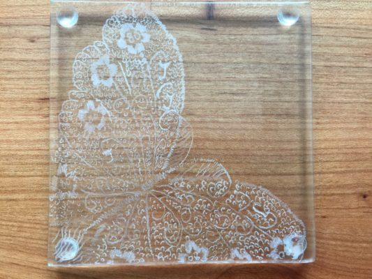 detail of glass butterfly engraved on glass