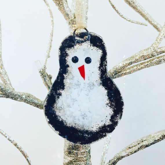 Perry Penguin fused glass hanging decoration in black and white glass. Made from recycled picture frame glass.