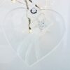 Fused glass heart with silver star decoration and white trail detial.
