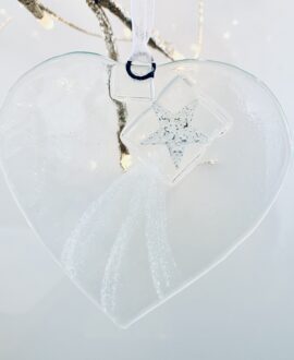 Fused glass heart with silver star decoration and white trail detial.